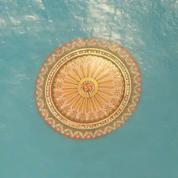 Swastika in the middle of a solar disc on the ceiling of Indian infrastructure